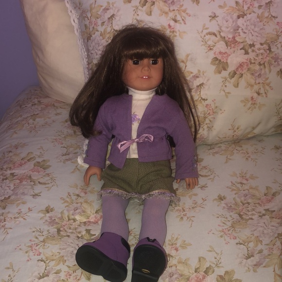 American Girl Doll with purple sweater outfit. Very good used condition 18”
